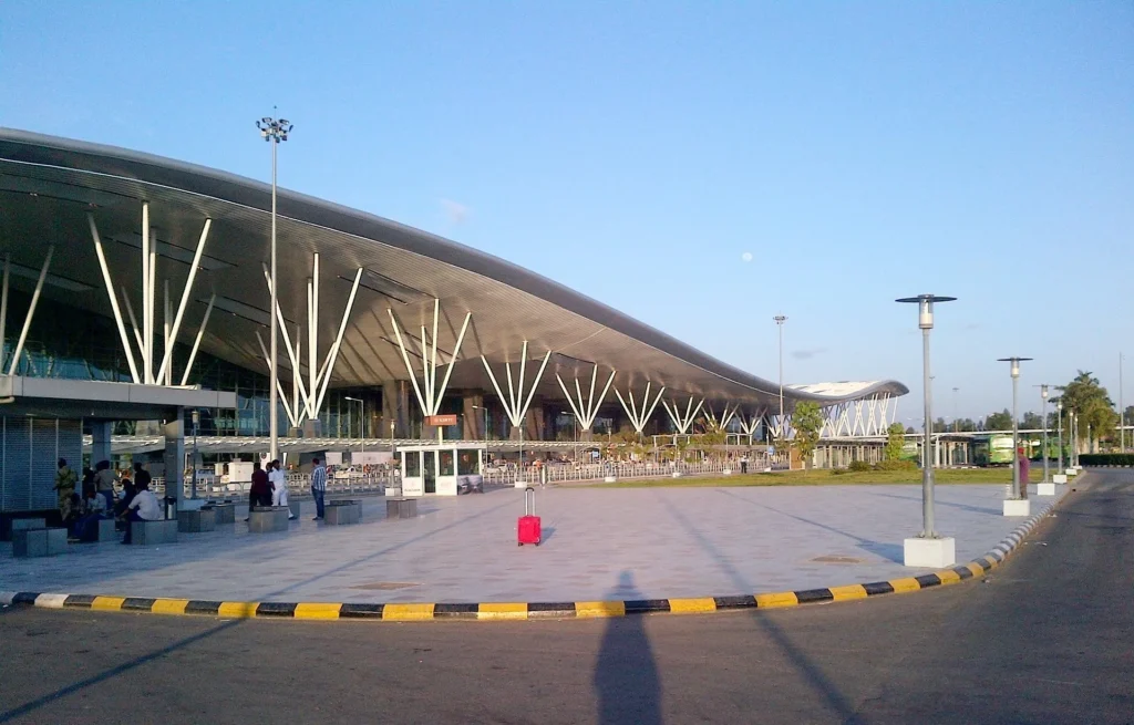 Dubai International Airport DXB with Emirates planes and modern terminal in 2026